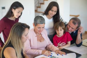 Family sitting together looking at resources for child mental health